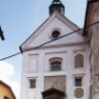 Nun's church. The Church of Mary Immaculate is situated beneath the Castle of Škofja Loka and they are connected, too.<br />The church was built in 1358 but its Baroque image was put on after  the fire in 1669.<br /> Precious tombstones and Baroque pulpit made of stone in the interior and the relief of crucifiction in the exterior could be seen. 